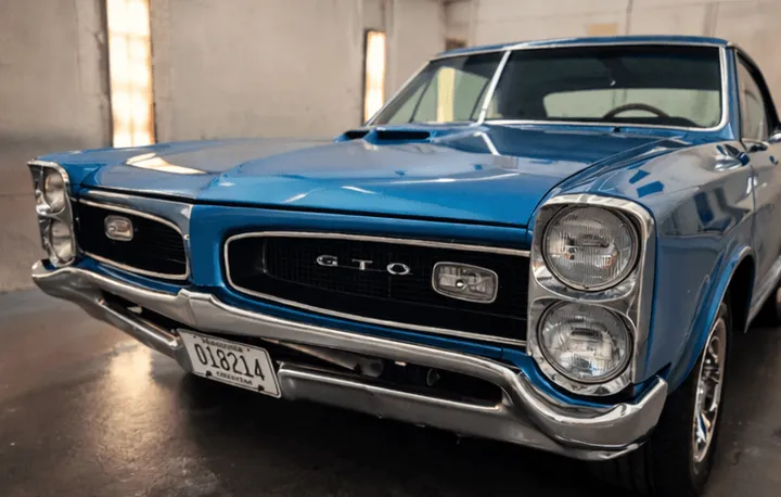 Freshly painted blue GTO restoration in the Scenic 61 paint booth
