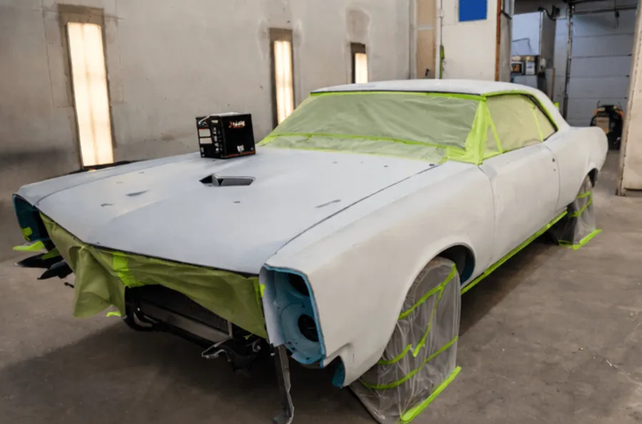 Blue GTO restoration in primer mid-project at Scenic 61 Auto Body